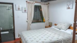 Postel nebo postele na pokoji v ubytování Hotel Rokas de Suesca