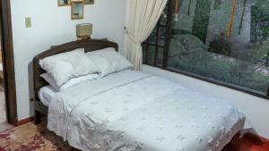 Postel nebo postele na pokoji v ubytování Hotel Rokas de Suesca