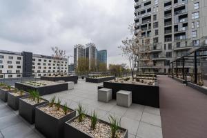 a row of planters on the roof of a building at Golden Apartments Sokolska 30 Towers - Great Location&59 in Katowice