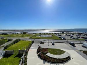 an aerial view of a parking lot next to the beach at Shoreline Apartments in Galway