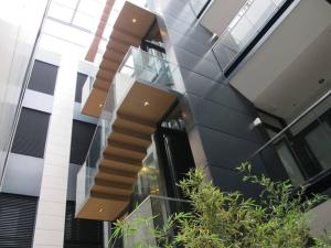 a glass building with a spiral staircase on it at Stunning & Modern Penthouse - Rambla - City centre in Tarragona