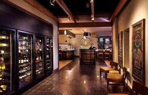 a restaurant with a bar and a man in the kitchen at Hilton Concord in Concord