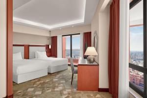 Postel nebo postele na pokoji v ubytování Ramses Hilton Hotel & Casino