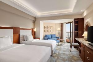Postel nebo postele na pokoji v ubytování Ramses Hilton Hotel & Casino