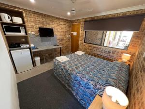 Postel nebo postele na pokoji v ubytování Golden Beach Motor Inn, Caloundra + 37 fotografií