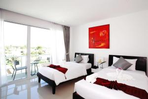 Gallery image of One World One Home Naiharn Hotel in Rawai Beach