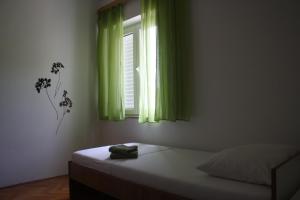 Postel nebo postele na pokoji v ubytování Apartment Pavo