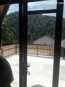 a window view of a yard with a fence at Cozy Cottage Dilijan Arm in Dilijan