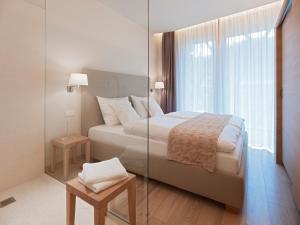 Posteľ alebo postele v izbe v ubytovaní Falkensteiner Residences edelweiss