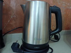 a coffee pot sitting on top of a stove at Apartamentos Luxury Puente de Triana in Seville