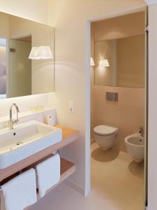 A bathroom at Falkensteiner Residences edelweiss