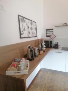 a kitchen with a counter with a box on it at Sweet Home Casa Vacanze il b&b in Songavazzo