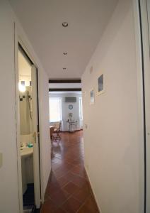 a hallway with a hallway leading to a room at La casa nel cuore di Camogli in Camogli