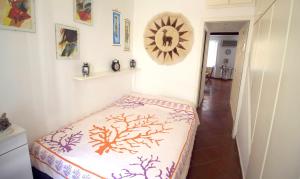 a room with a bed and a mirror on the wall at La casa nel cuore di Camogli in Camogli