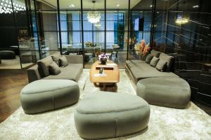 a living room with couches and a coffee table at The Mill Bomonti in Istanbul