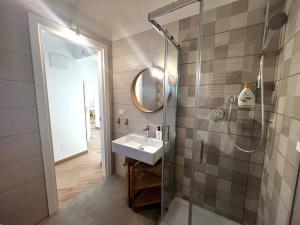 a bathroom with a sink and a glass shower at Liberty Villa 2 in Bari +36 photos