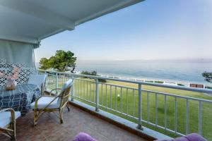 a balcony with a view of the ocean at Ethereal Beach House in Hanioti +20 photos