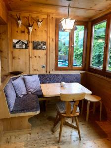 a living room with a couch and a table at Haus Huber in Bad Hindelang