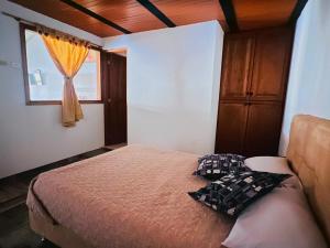 a bedroom with a bed and a window at Villa villa in Villa de Leyva