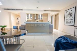 a waiting room at a dental clinic with a dental office at Quill Residence at Paramount Towers 3 BR Creek View in Dubai