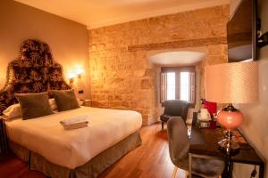 TV a/nebo společenská místnost v ubytování Hotel Don Juan Boutique