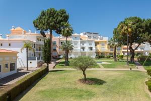 a view of a park with trees and buildings at Jardins de Santa Eulália By Albufeira Rental in Albufeira