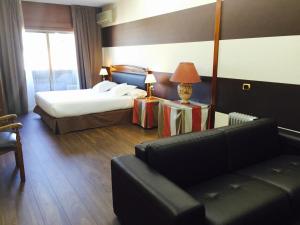 Łóżko lub łóżka w pokoju w obiekcie Oca Ipanema Hotel