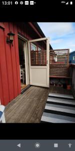 an open door of a house with a deck at Nardo-Trondheim in Trondheim