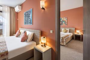 Ліжко або ліжка в номері Melia Sunny Beach All Inclusive