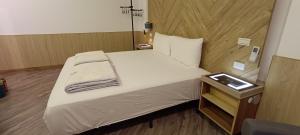 Postel nebo postele na pokoji v ubytování Kanalung Yurakucho House