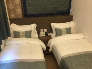 Katil atau katil-katil dalam bilik di Seasons Hotel - Causeway Bay
