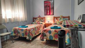 Łóżko lub łóżka w pokoju w obiekcie Apartamento Galeon XXI