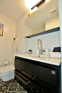 a bathroom with a sink and a toilet at beautiful 2 bedrooms apartment with balcony in Tel Aviv