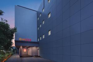 a building with a sign on the side of it at Ginger Vadodara in Vadodara