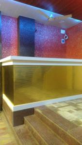 a counter in a room with colorful walls at HOTEL OM SAI in Vovale