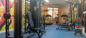 a gym with a row of treadms and machines at World Flat Hotel - Vila Olímpia in Sao Paulo