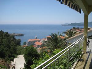 a view of the ocean from a balcony at Apartmani Famelja Jovanovic in Sveti Stefan