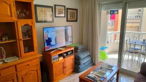 TV a/nebo společenská místnost v ubytování Apartamento Galeon XXI