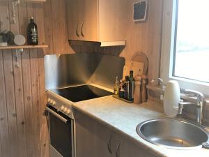 a kitchen with a sink and a counter top at (id 081) Åbakken 19 in Esbjerg