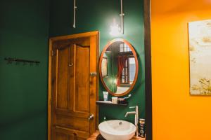 a bathroom with a sink and a mirror at Kar-Wai's in Ho Chi Minh City