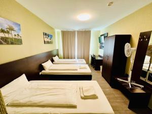 Postel nebo postele na pokoji v ubytování Hotel City Star