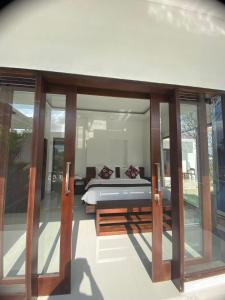 Letto o letti in una camera di Namika Villas Ubud