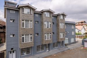 an image of a building with many windows at Hotel Grand Boulevard Dal Lake View Srinagar in Srinagar