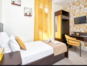 Postel nebo postele na pokoji v ubytování Hotel du Vieux Port