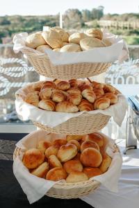 three baskets filled with different types of bread at Carvi Beach Hotel in Lagos
