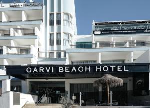 a hotel with a sign for a beach hotel at Carvi Beach Hotel in Lagos