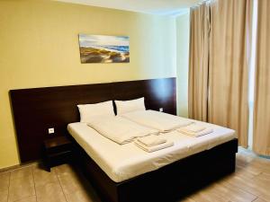 Postel nebo postele na pokoji v ubytování Hotel City Star