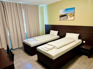 Postel nebo postele na pokoji v ubytování Hotel City Star
