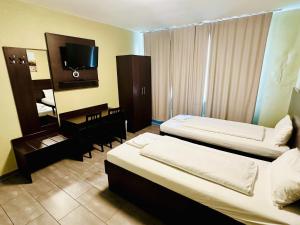 Postel nebo postele na pokoji v ubytování Hotel City Star