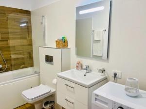 a bathroom with a sink and a toilet and a shower at Joy City Stay Vivalia 7B-26 in Timişoara +25 photos